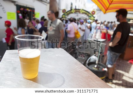 CAMPO MAIOR, PORTUGAL -23 AUGUST 2015: Flower festival in Campo Maior with a glass of beer for sell at decorared streets, on 23 August 2015 Campo Maior,  Portugal