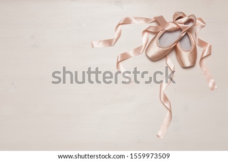 Similar – Image, Stock Photo Ballet shoes with ribbons on a white tutu in a dance studio