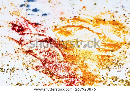 Abstract background with splash of color pigments on gray paper
