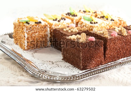 Variety of cakes on a silver platter