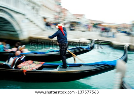 Gondolier on a gondola on the Grand Canal. Italy, Venice - Motion Blur