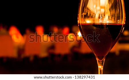 Glass of Red Wine in Romantic Restaurant Setting