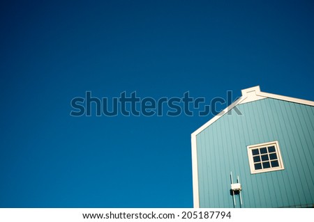Blue house in front of blue sky