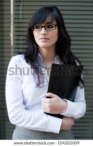 Smart looking asian woman holding a folder