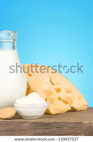 milk and cheese at wood board