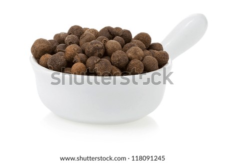 allspice spices in bowl isolated on white background