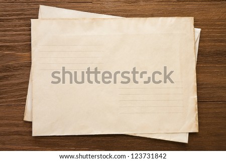 old postal envelope on wood background