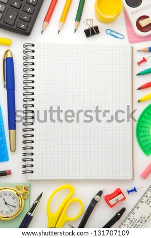 notebook and school  supplies isolated on white background