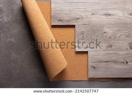 Laminate wood floor on cork background texture. Wooden laminate floor and corkboard with copy space Foto d'archivio © 