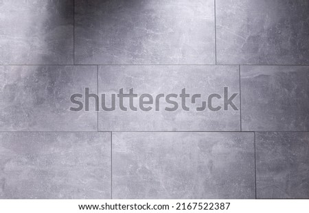 Grey laminate or tile background at floor texture. Gray flooring laminate top view Сток-фото © 