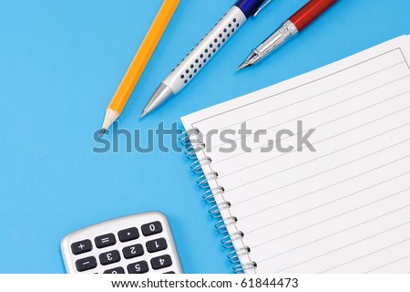 ink pen, pencil and calculator with binder pad