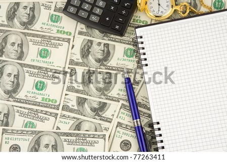 notebook, pen, calculator and watch at dollars