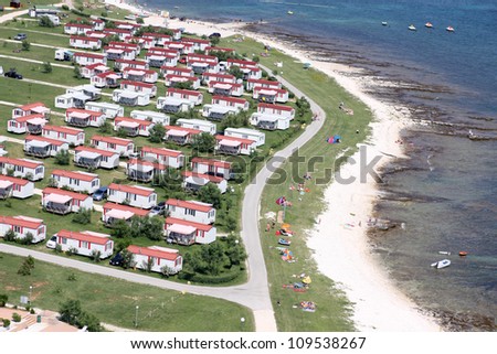 Modern static caravan on campsite during summer near the sea, holiday or vacation scene. Adriatic sea, Croatia - Aerial view