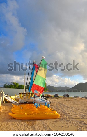 Sailing boats drawn up on the beach in the caribbean.