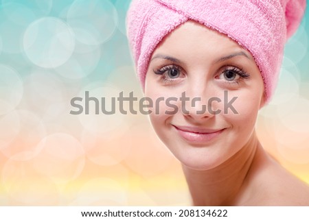 magic spa: blue eyes sexy pretty woman in towel touching with silk skin happy smiling & looking at camera on light copy space background, closeup portrait