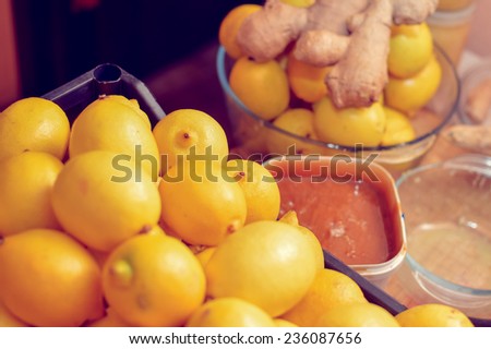 closeup image of food making process & organic healthy ingredients as lemon, honey & ginger