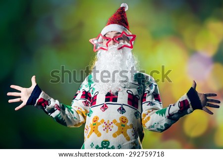 Young man in Santa Claus costume on festival lights background