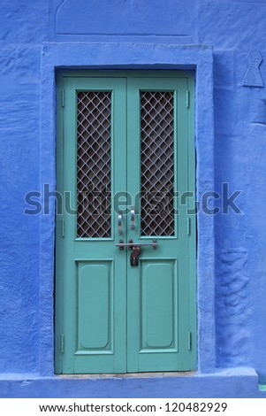 Painted wooden door in the blue city of Jodhpur, Rajasthan. India.