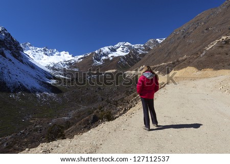 Tsopta Valley, Sikkim - India. Woman enjoying the view.