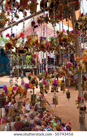 Brightly colored elephant wind chimes for sale in Anjuna Market - Goa