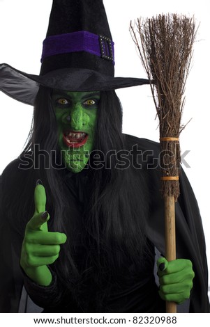 Scary Green Witch Carrying Her Broom And Pointing Her Finger, White ...