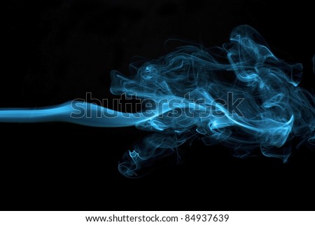 Abstract blue colored smoke isolated on black