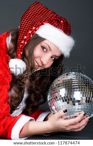 The cute girl with Christmas cap and mirror ball