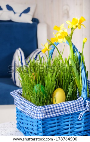 Blue basket with eggs in blue interior