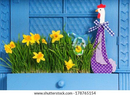 Blue cabinet with flowers and poult