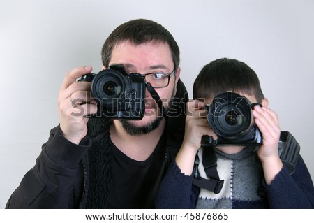 Father and son with cameras