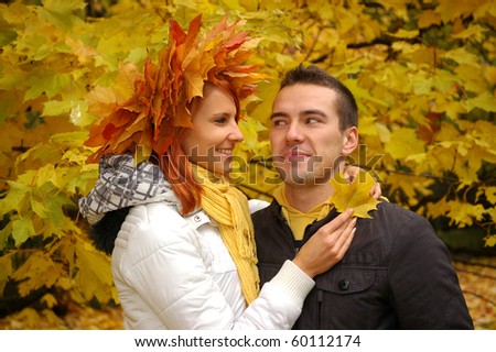 Happy young couple in love meeting in the autumn park