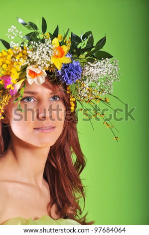Spring-woman in wreath of flowers