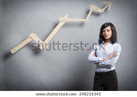 Concept: Positive business outlook. Smiling confident businesswoman in front of business graph with upward trend, isolated on grey background