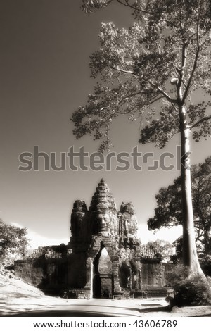Gate to Angkor Thom with huge tree, Angkor, Cambodia.  infrared monochrome image
