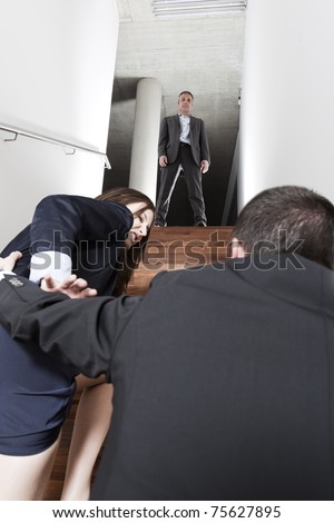 Boss Watching Male Employee Molesting Female Colleague In Office. Stock ...