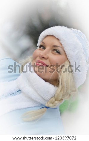 smiling girl dressed in traditional russian christmas costume of Snegurochka (Snow Maiden)