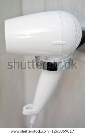 Beautiful and diverse subject. Beautiful and expensive blonde, white electric fke and a hair and body dryer in the bathroom. Stok fotoğraf © 