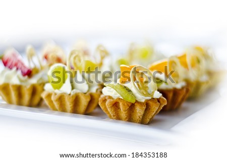 tasty snacks pastry with custard and fruit on a white background