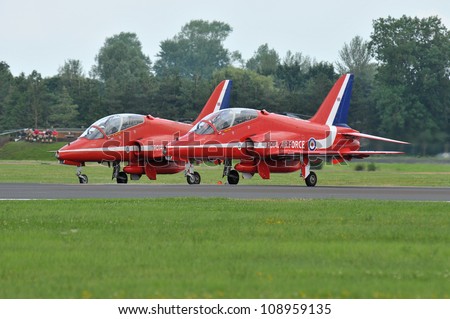 FAIRFORD, UK - JULY 8: Royal Air Force Hawk of the Red Arrows Display Team participates in the Royal International Air Tattoo airshow event July 8, 2012 near Cirencester, England.