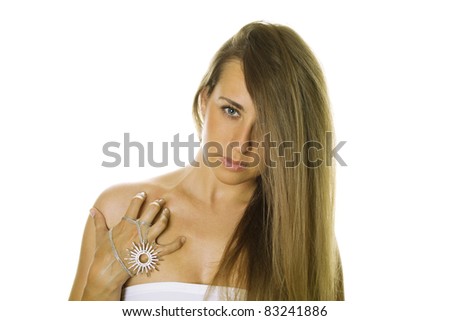 Close-up of a beautiful young woman with expensive jewelry. Isolated on a white background