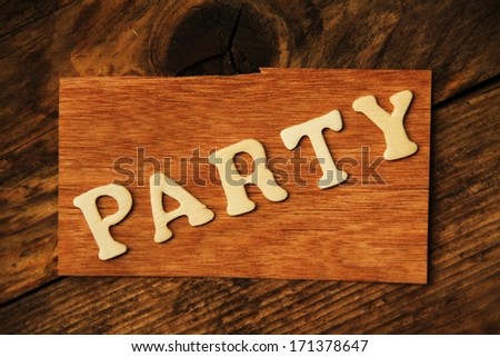 the German word PARTY on wood
