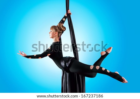 Beautiful dancer on aerial silk, aerial contortion, aerial ribbons, aerial silks, aerial tissues, fabric, ribbon, tissue