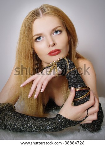 Portrait of elegant  young women  with gold accessories