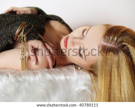 Portrait of elegant young women with gold accessories
