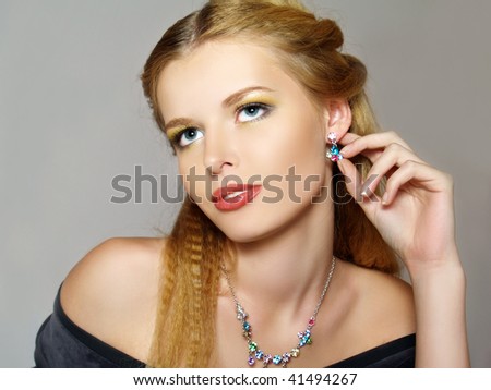 Portrait of beautiful young fashion model with jewelry