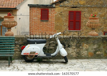 Similar – Image, Stock Photo Classic green Vespa Scooter parked in the sidewalk.