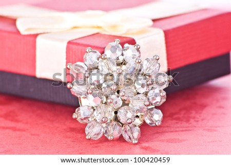 Jewelry and gift box on red background
