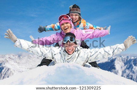 Group of young friends enjoying  in winter resort