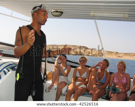 RED SEA, EGYPT- SEPTEMBER 09:  Arab dive-instructor give diving lesson to tourists before diving in the Red sea September 09, 2009 in Charm el Sheikh, Egypt
