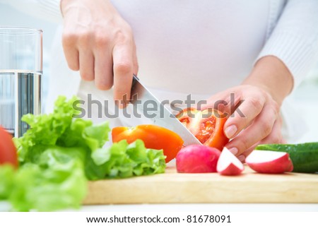Human hands  cooking vegetables salad in kitchen